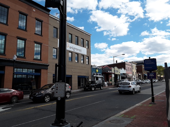 Two new office buildings dwarf We Act Radio and neighboring properties. photo from 2023